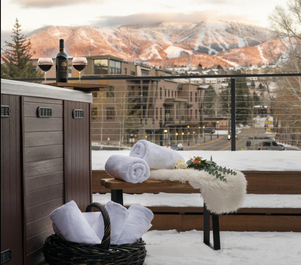 Towels and a view of the mountains at a resort.